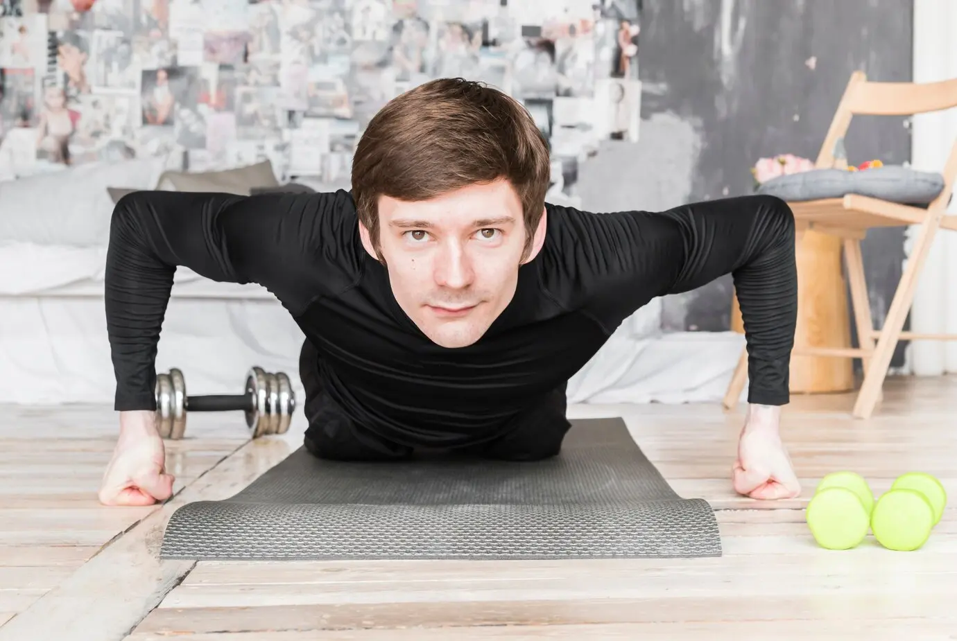 A man doing push ups on mat