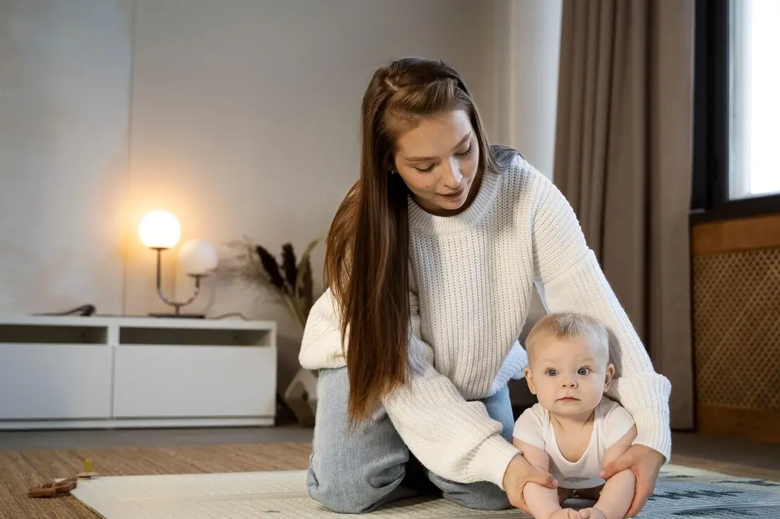 Mother taking care of her child alone at home