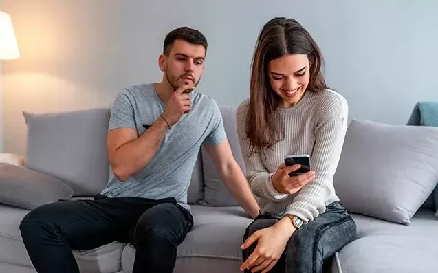 
Boy is reading his girlfriend's text messages
