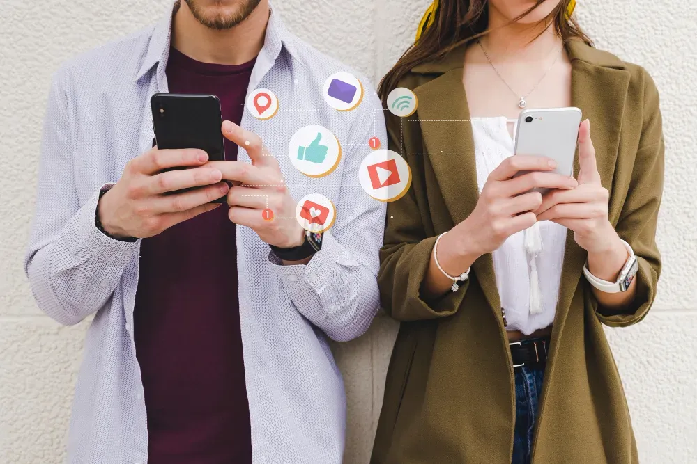 Couple holding phones and checking social media