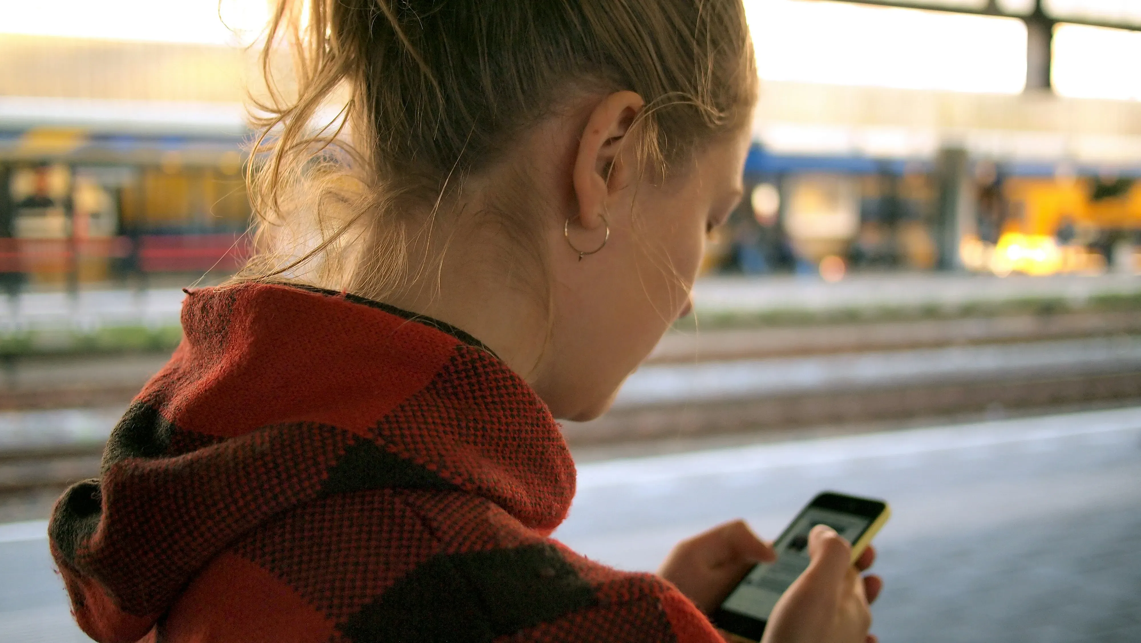 Wife looking sad at her husband texts and calls