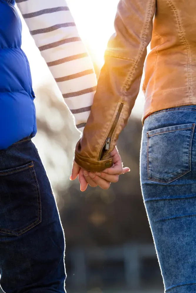 Couple holding hands rebuilding trust after cheating