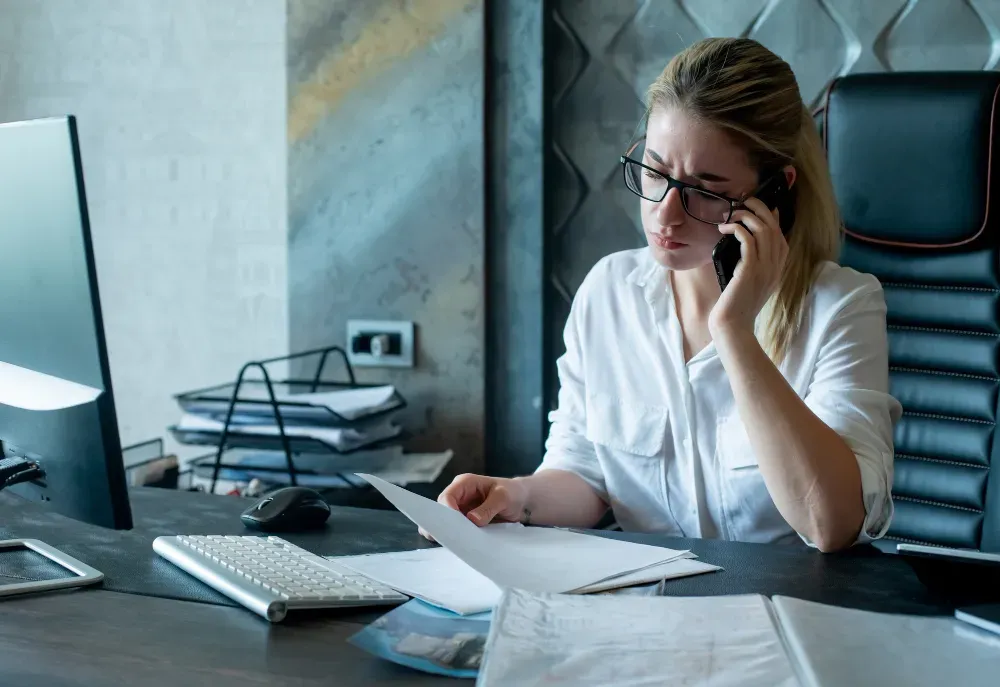 Woman checking bank statements to expose a cheater